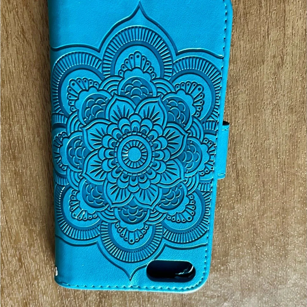 Magnetic close Leather IPhone wallet fits iPhone 7 or 8 in Turquoise color.